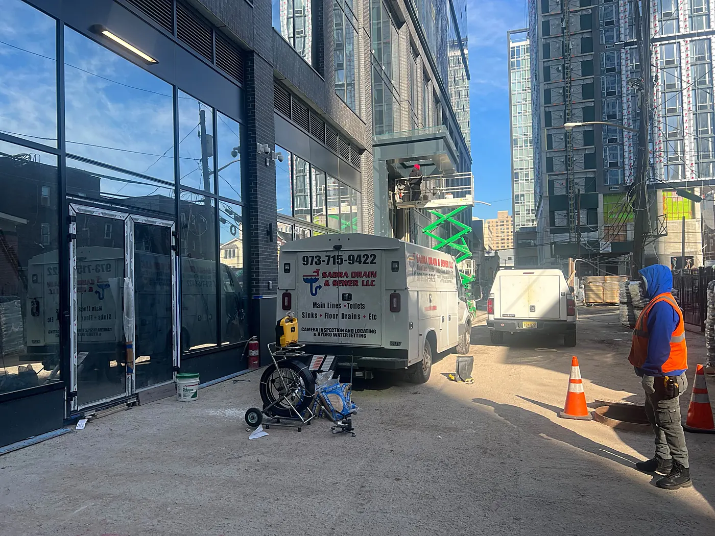 Sabra Drain & Sewer truck and crew at a manhole on a new construction site in New Jersey