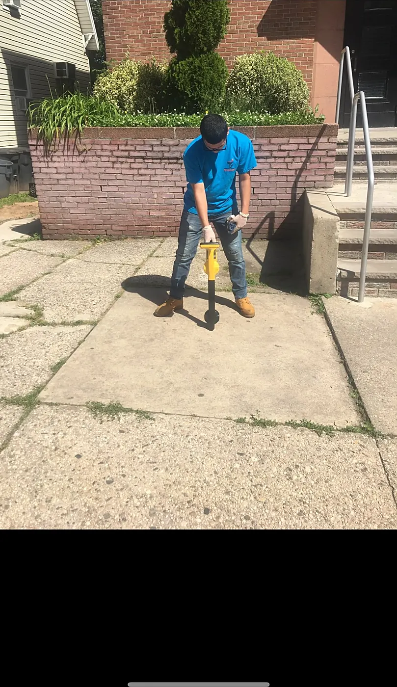 Sabra technician locating an underground sewer line on a New Jersey sidewalk