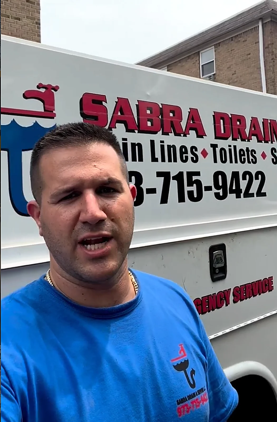 Sabra technician beside Drain & Sewer service truck